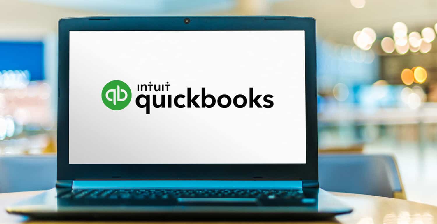 Laptop computer displaying logo of QuickBooks