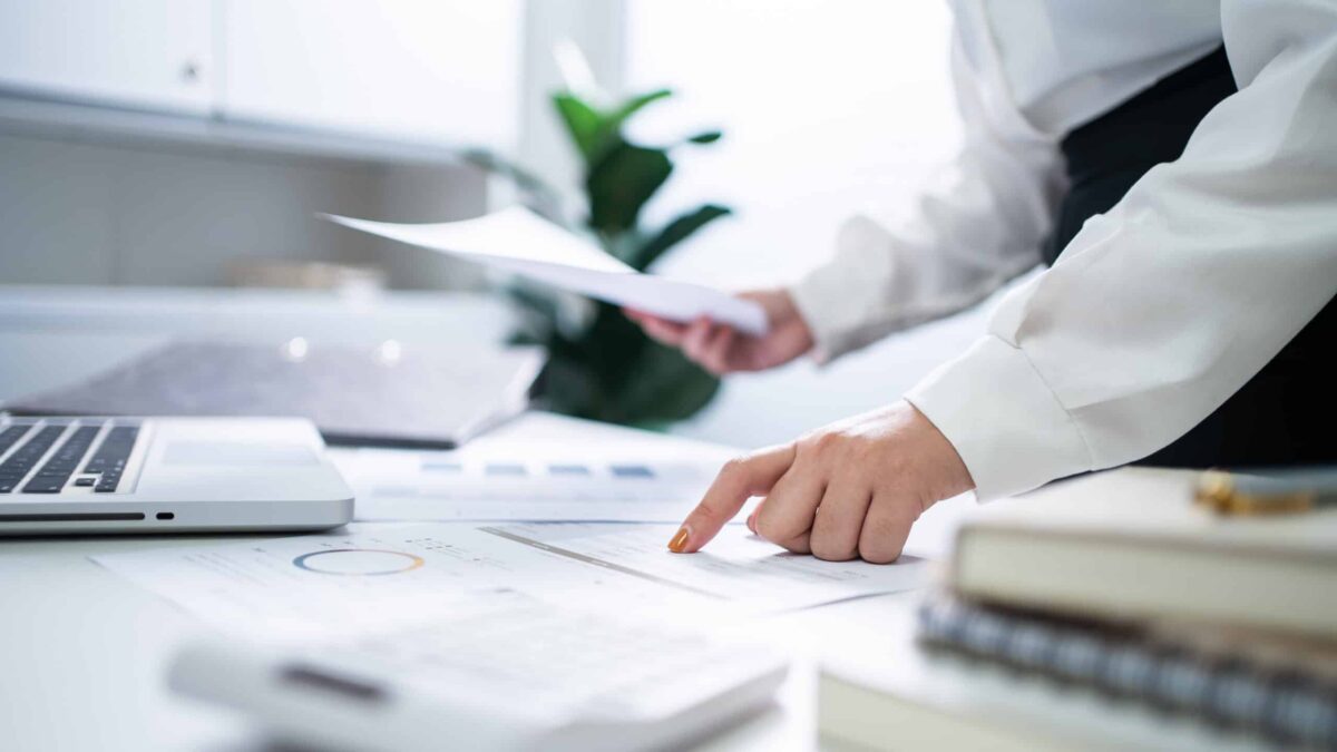 A CFO looks over financial documents.